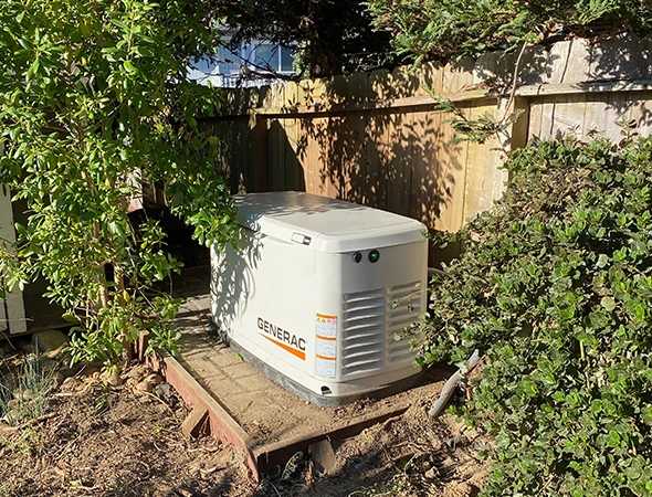 A specialist preparing a residential backup power generator for emergency use in Menlo Park.
