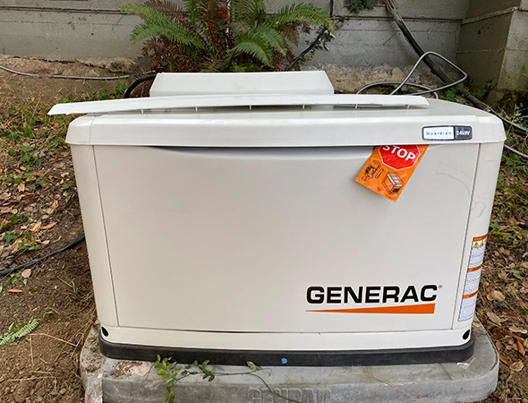 Charles Electric team configuring a heavy-duty backup power generator for a business in Woodside.