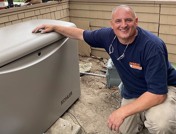 Our specialist checking a large unit to complete a full generator maintenance services visit.