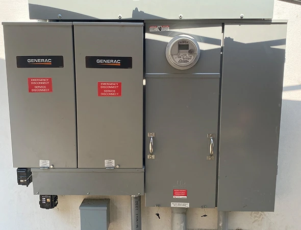 Gray electrical boxes and meters connected as part of our high-quality battery backup services.