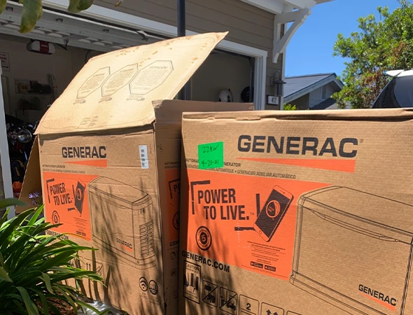 Large cardboard boxes containing new equipment for a high-quality standby generator installation.