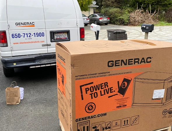 A Charles Electric service van parked near a new Generac box during a standby generator installation visit.