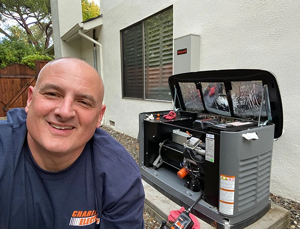 From our Atherton service area, a friendly technician smiles next to a newly serviced generator.
