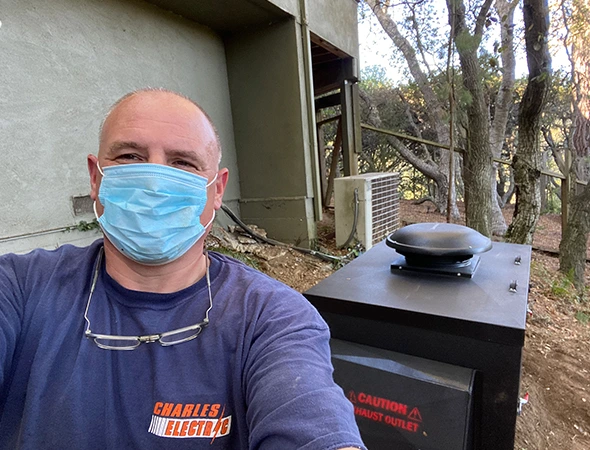 On an Atherton property, our technician stands by a standby unit to ensure it is storm-ready.