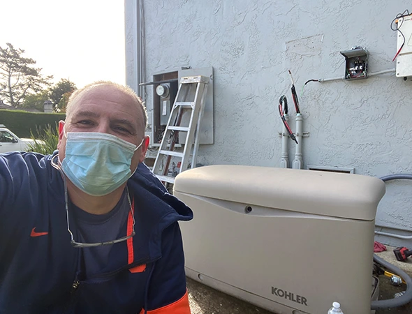 In Atherton, our specialist wears a protective blue mask while performing a routine system check.
