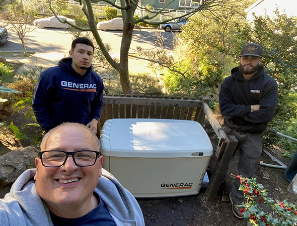 Our crew posing with a new backup unit during a successful residential setup in Hillsborough.