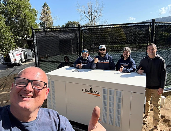 Our team giving a thumbs up after finishing a thorough generator inspection for a family in Los Altos Hills.