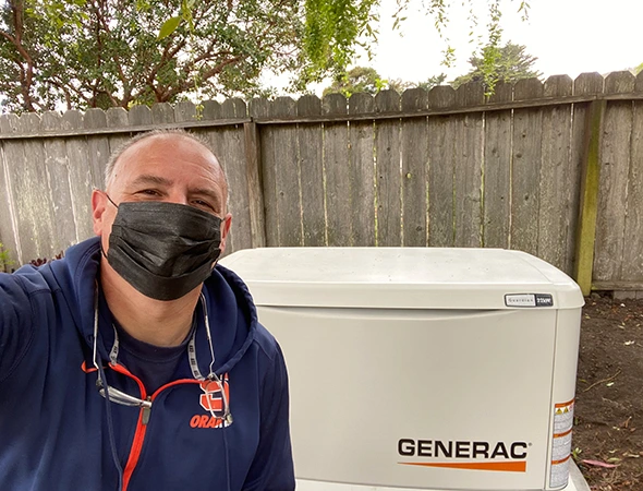 Our friendly technician in Menlo Park standing next to a new unit while explaining how it works.