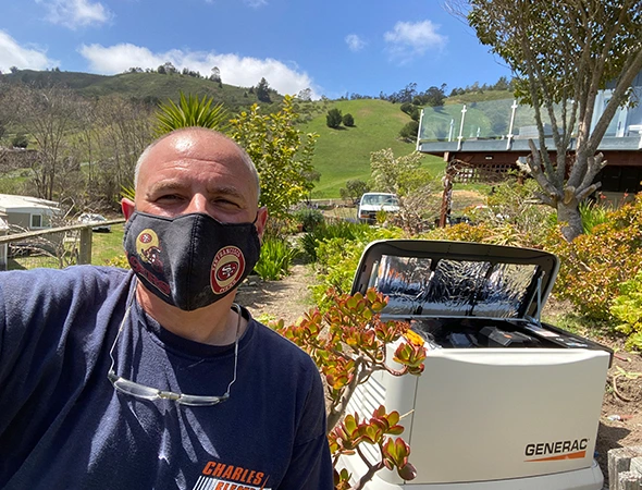 Standing outdoors in San Carlos, our friendly technician is ready to help with backup power.